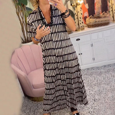 Elegante maxivestido de manga corta con sofisticado cuello en V