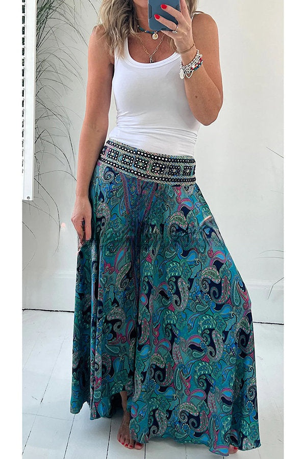 Elegantes pantalones ligeros con bolsillo y cintura elástica en atractivo estampado étnico de cachemira