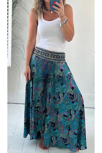 Elegantes pantalones ligeros con bolsillo y cintura elástica en atractivo estampado étnico de cachemira