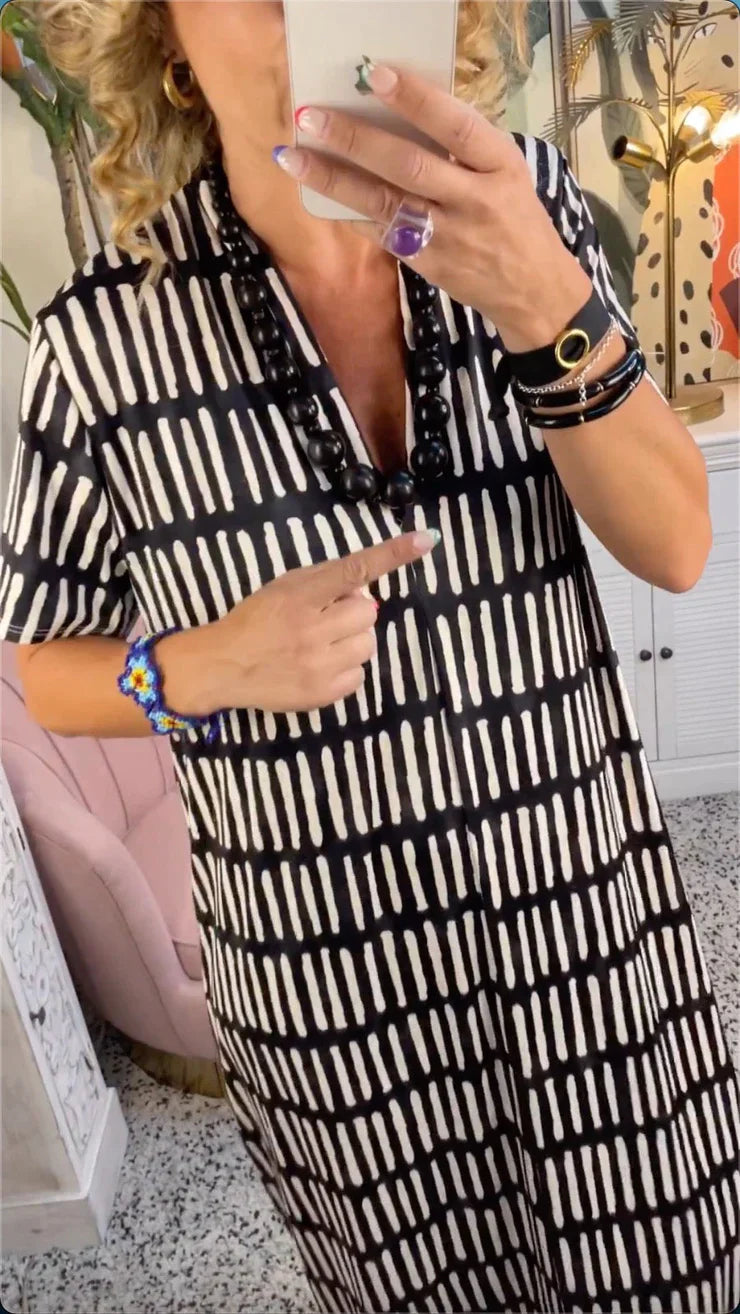 Elegante maxivestido de manga corta con sofisticado cuello en V