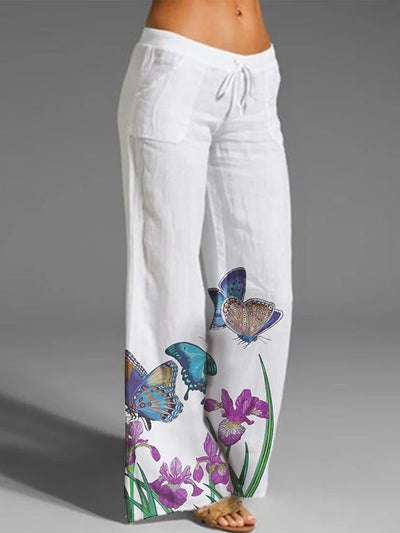 Encantadores pantalones blancos casuales con diseño de mariposas y prácticos bolsillos