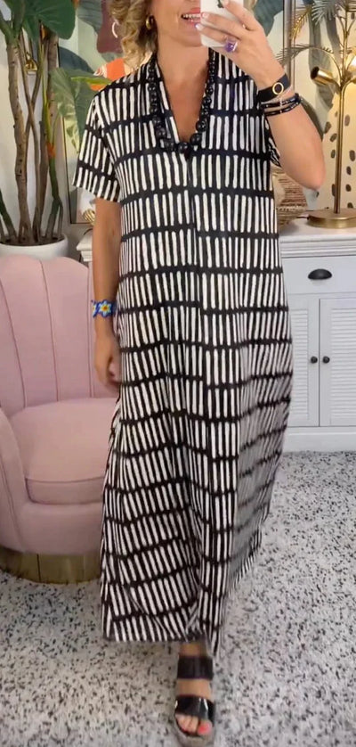Elegante maxivestido de manga corta con sofisticado cuello en V