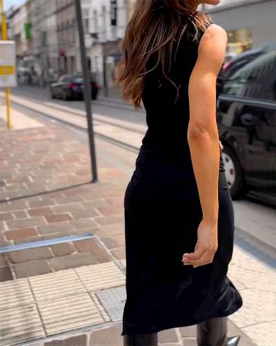 Elegante vestido sin mangas de cuello redondo con delicado lazo en tonos lisos