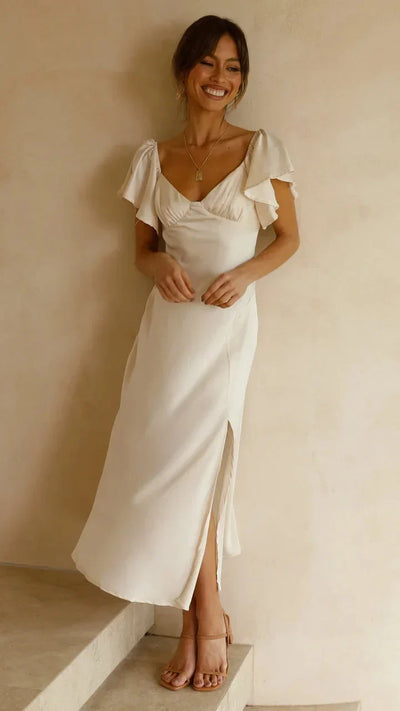 Elegante vestido midi marfil con encantadores hombros al aire