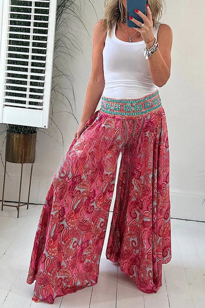 Elegantes pantalones ligeros con bolsillo y cintura elástica en atractivo estampado étnico de cachemira
